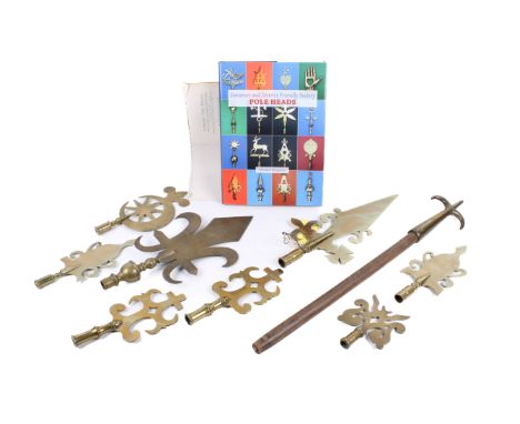 A collection of vintage Friendly Society brass staff finials and a relevant book. Of various sizes and designs, some having p