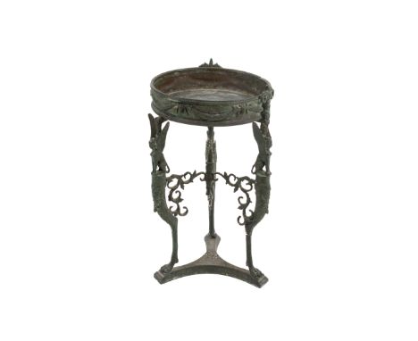 An early 20th century small bronze athenienne. The circular stand with laurel decoration around the sides, mounted on a tripo