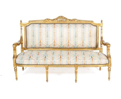 A 19th century two piece suite. Comprising a sofa and an armchair, both having carved and moulded gilt wood frames, the armre