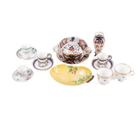A collection of Royal Crown Derby and other porcelain pieces. Including a pair of silver mounted Royal Worcester cups and sau