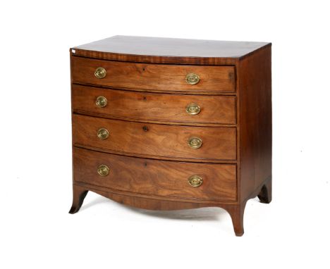 A 19th century mahogany bow front chest of drawers. Having four long graduated drawers with cock beading later oval brass swi