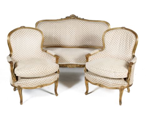 A circa early 20th century, Louis XV style gilt wood salon suite. Comprising a sofa and six early 20th century chairs. Sofa d