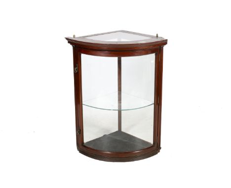 A circa 1900 English bow fronted glazed display corner cupboard with shelf. Mahogany framed with large curved bevelled glass 