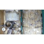 A mixed collection of metal ware and glass ware to include teapot, milk jug, sugar tongs, serving