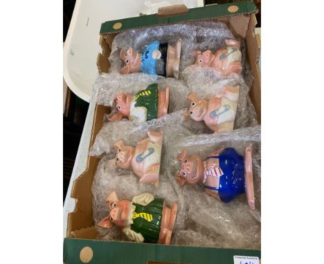 A collection of 7 Wade NatWest pigs with original NatWest stoppers 