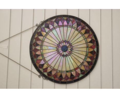 A large Tiffany style window decoration of sun burst design, with hanging chain, 61cm diameter.