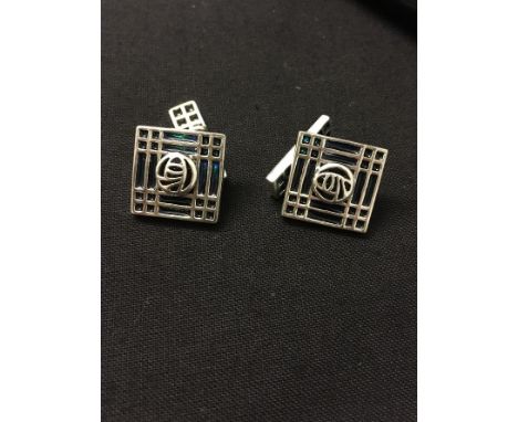 A pair of silver enamel cufflinks with chain and enamel T bar.