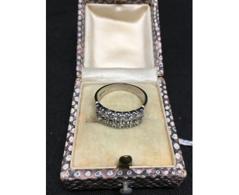 An 18ct white gold near matched double row diamond dress ring, 14 diamonds in total, size M, approximately 3.8 grams.