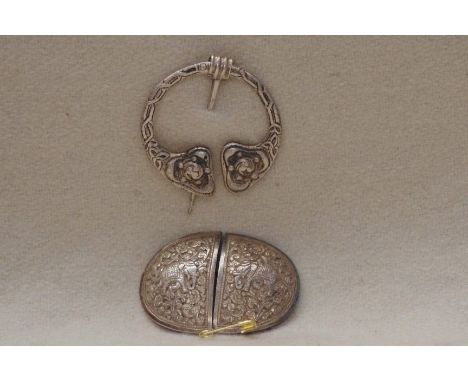 An Indian silver belt buckle and a Scottish silver kilt/scarf brooch, maker ROBERT ALLISON, Glasgow, 1946.