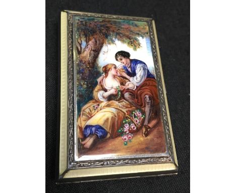 A fine Continental silver and enamel compact depicting a man and woman under a tree, with an internal silver gilt mirrored co