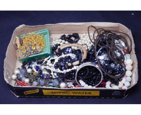 A box of assorted jewellery including French jet beads, a silver bangle, etc.