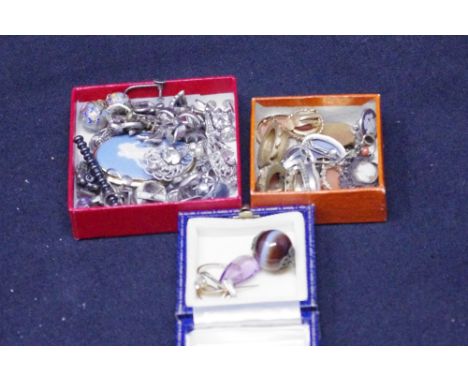 An interesting box of assorted jewellery including cameo earrings, paste, marcasite earrings, enamel, jade, a Wedgwood brooch