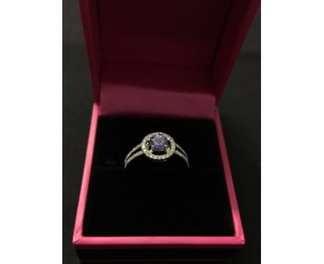 An 18ct white gold tanzanite and diamond ring of approximately 1.25cts, size L/M.