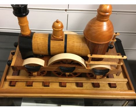 A scratch built wooden model of an early stream engine.