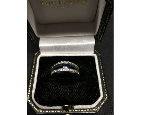An 18ct white gold sapphire and diamond dress ring with modern setting, size M, approximately 5.0 grams.