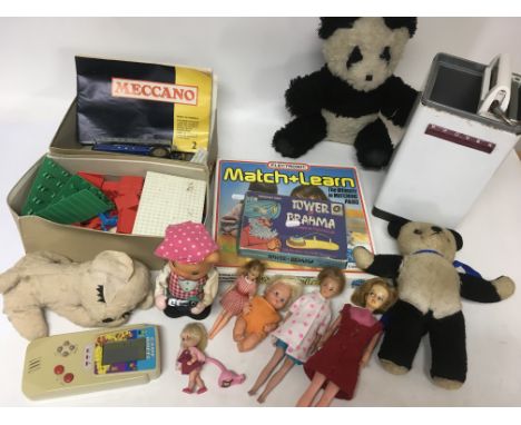 A collection of vintage toys and games including clock work, plastic and tin plate items