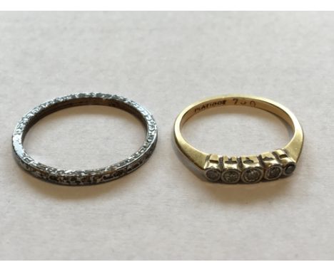 An 18 carat diamond ring and one other ring in a vintage ring box.