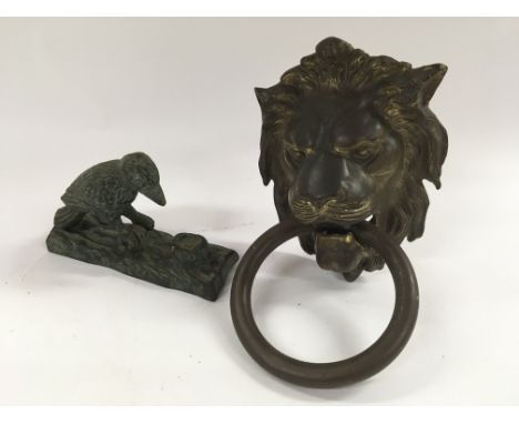 Brass lions mask door knocker and unusual woodpecker door knocker.