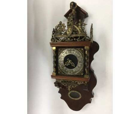 A 20th Century reproduction Dutch wall clock with brass fittings.