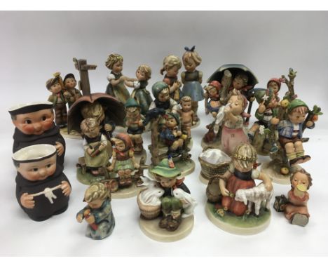 A collection of various Goebel figures.