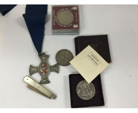 A silver and enamel Cross Chelmsford readers a 1935 crown other coins and a folding knife.