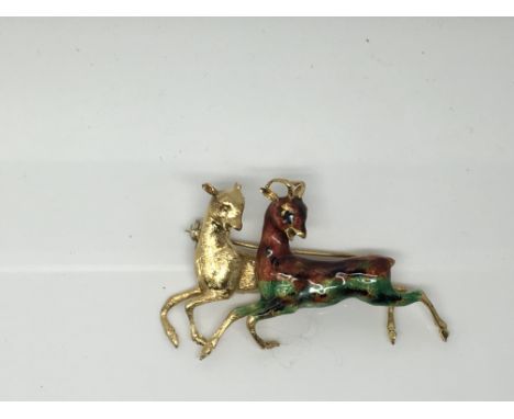 A gold brooch marked 750, formed as two deer one with enamel decoration