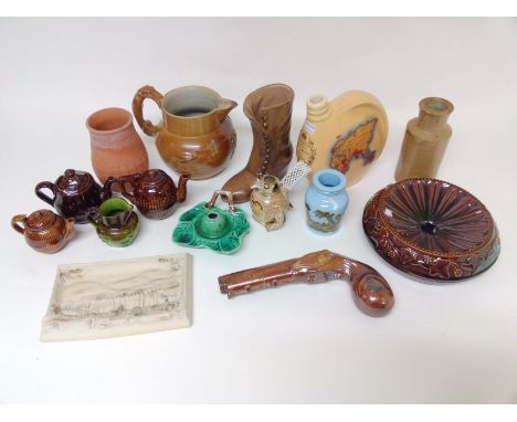 A collection of various stoneware items including a spitoon, a pistol, a coronation flask, 3 toyware teapots, a Majolica inkw