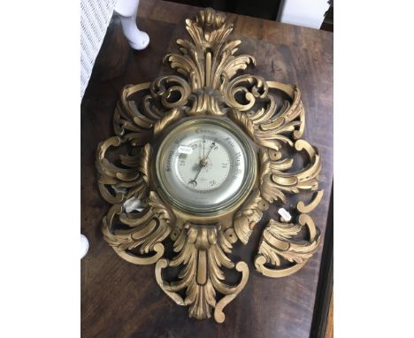 A giltwood barometer with scrollwork decoration a/f.