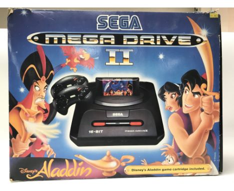 A rare, boxed Sega Megadrive II console with the Disney Aladdin game included, comes with original slip cover. Also comes wit