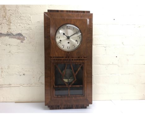 A large walnut veneer art deco wall clock including keys measuring approximately 68cm in height