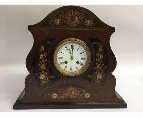 An inlaid mantle clock with enamel dial. Approx 33x39cm long