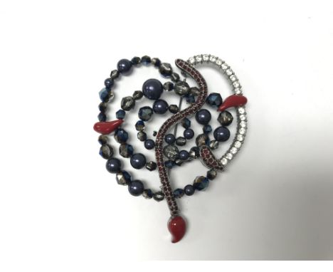 A Swarovski heart shaped brooch with diamonte, enamel and crystal.