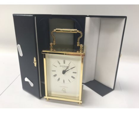 A boxed battery run carriage clock in a fitted case.