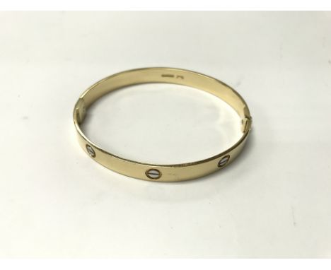 An 18ct gold bangle. Weight approx 25g