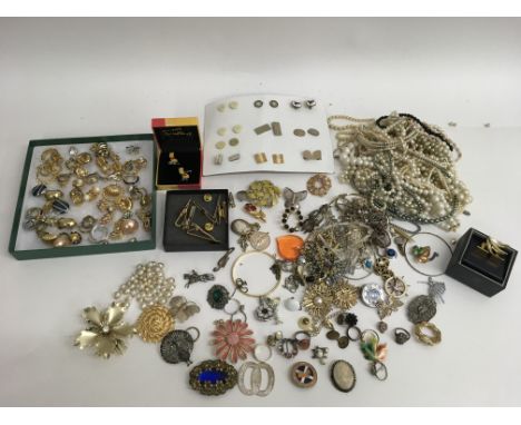 A collection of various costume jewellery including brooches, earrings and cufflinks