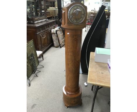 A walnut cased grandaughter clock.