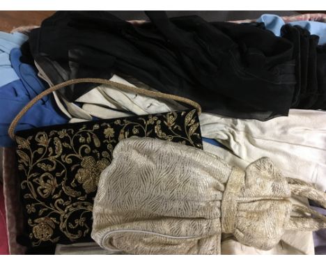 A collection of vintage clothes and a handbag