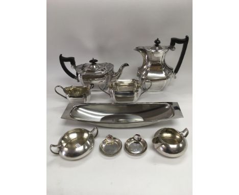 A collection of metalware including a four piece silver plated tea service.
