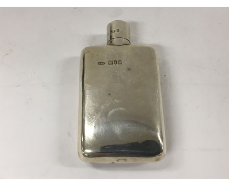 A small silver hip flask with London hallmarks. maker Aspreys of London  9cm.