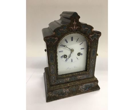 An eight day Leroy of Paris mantle clock with brightly painted case, the white enamel dial with Roman numerals, approx height