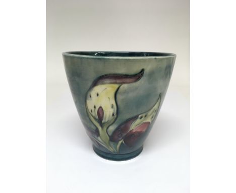A Walter Moorcroft 'Arum Lily' pattern planter, painted and impressed marks to base.Approx 16cm, some crazing