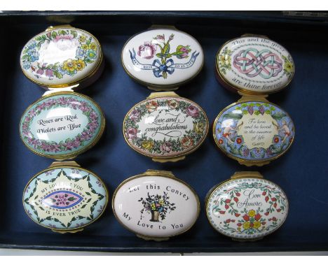 Nine Halcyon Days Enamel 'Love Token' Oval Trinket Boxes, each with sentimental words to hinged lid, 5 x 4cm. (9)