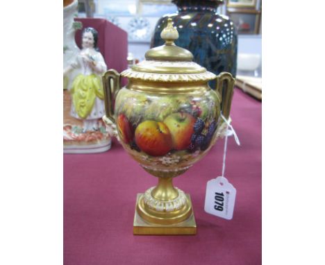 A Royal Worcester Porcelain Vase and Cover, of globular two handled form with mask terminals, raised on a stepped square base