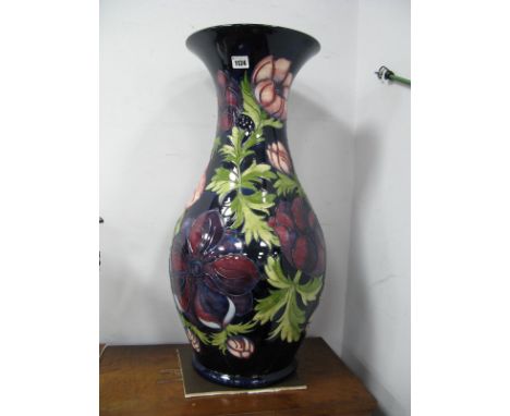 A Large Moorcroft Pottery Floor Vase, of baluster form, painted in the 'Anemone' pattern against a dark blue ground, impresse