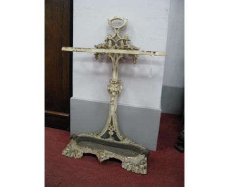 A Late XIX Century White Painted Cast Iron Stick Stand, the shaped back plate decorated with foliage, double division and lif