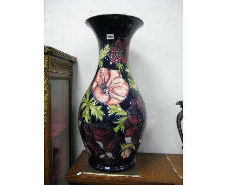 A Large Moorcroft Pottery Floor Vase, of baluster form, painted in the 'Anemone' pattern against a dark blue ground, impresse