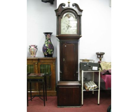 An XVIII Century Oak and Mahogany Longcase Clock, the hood with swan neck pediment, arched door and column supports, eight da