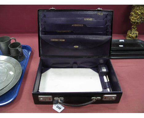 An Early XX Century Leather Stationary Case, the purple interior with compartments labelled paid, unpaid, answered, unanswere