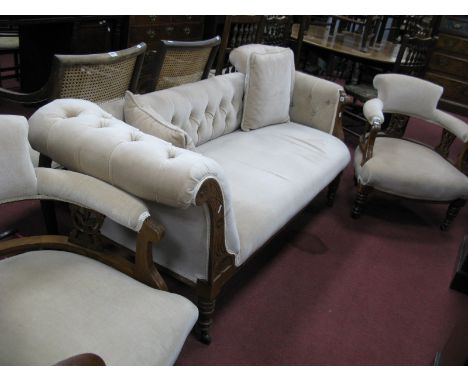 An Early XX Century Walnut Three Piece Salon Suite, comprising chaise longue with button back upholstery, on turned and reede