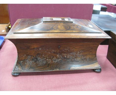 A Mid XIX Century Rosewood Tea Caddy, of sarcophagus form raised on bun feet, the interior with two caddies and central compa